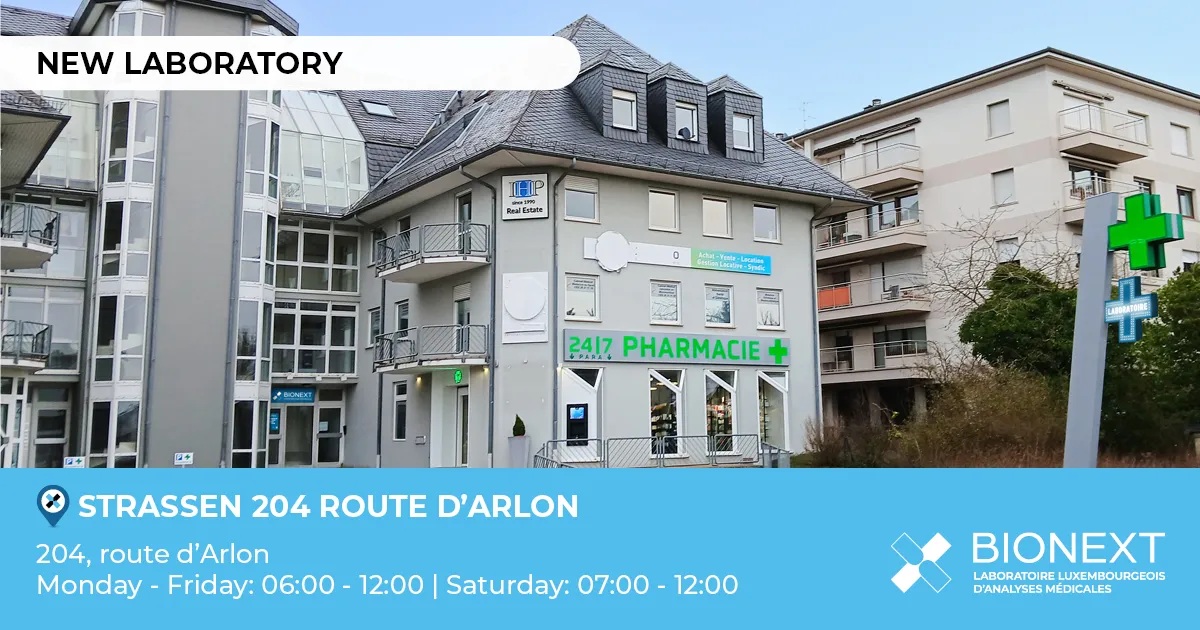 Front view of a new BIONEXT laboratory located at 204, route d’Arlon in Strassen, next to a pharmacy marked by a green illuminated cross. The image displays the heading ‘New laboratory’ and opening hours: Monday to Friday from 06:00 to 12:00, and Saturday from 07:00 to 12:00.